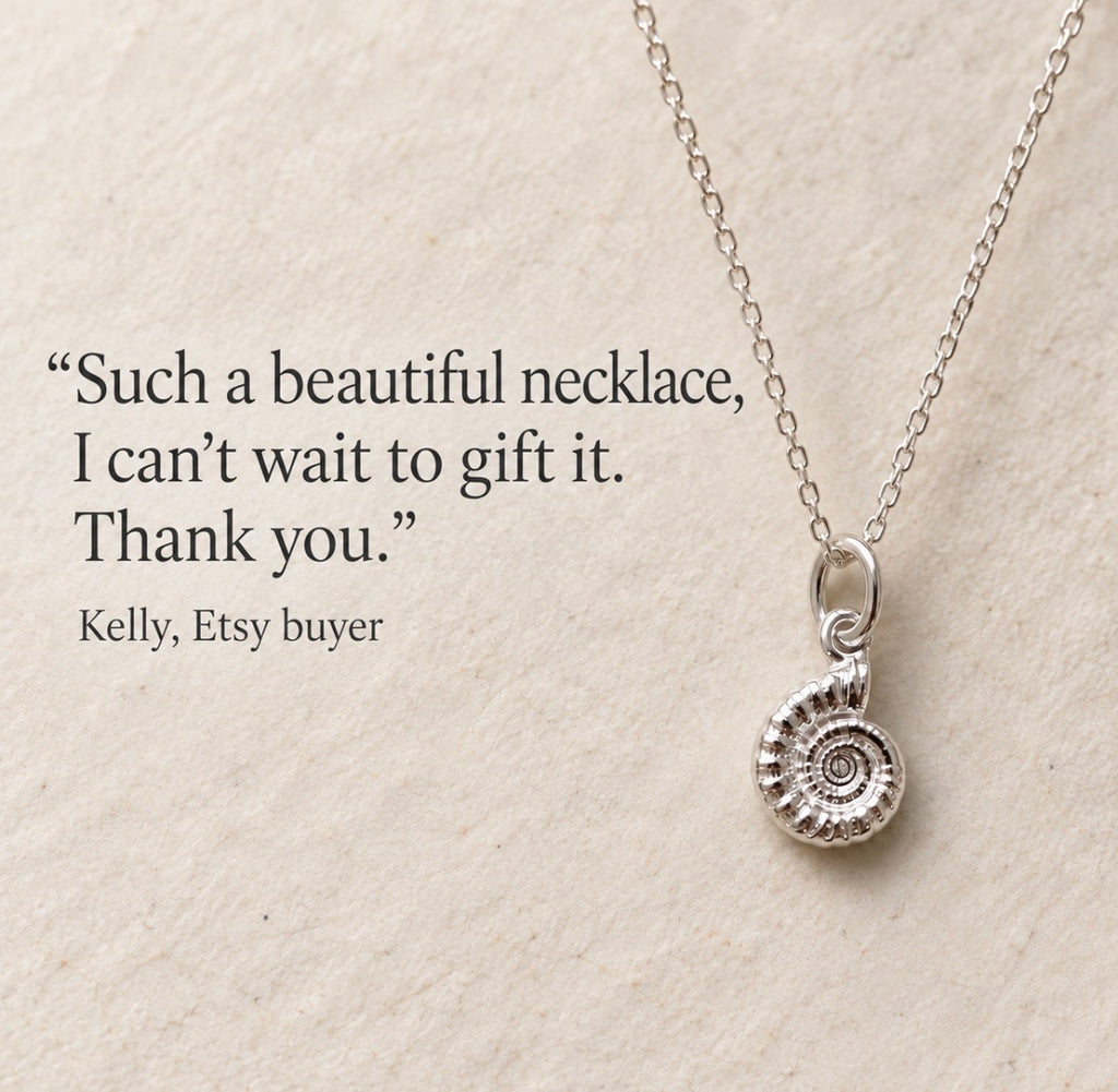 A silver necklace with an ammonite fossil pendant, displayed on a textured beige background next to a quote from an Etsy buyer.