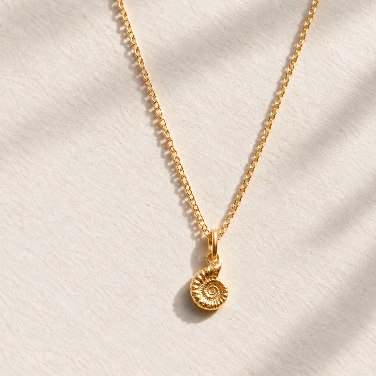 Gold vermeil ammonite fossil pendant