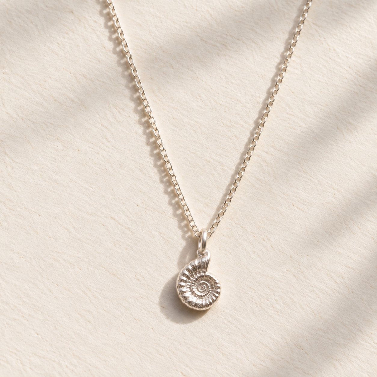 Sterling silver ammonite fossil necklace with delicate chain, small 9mm spiral pendant