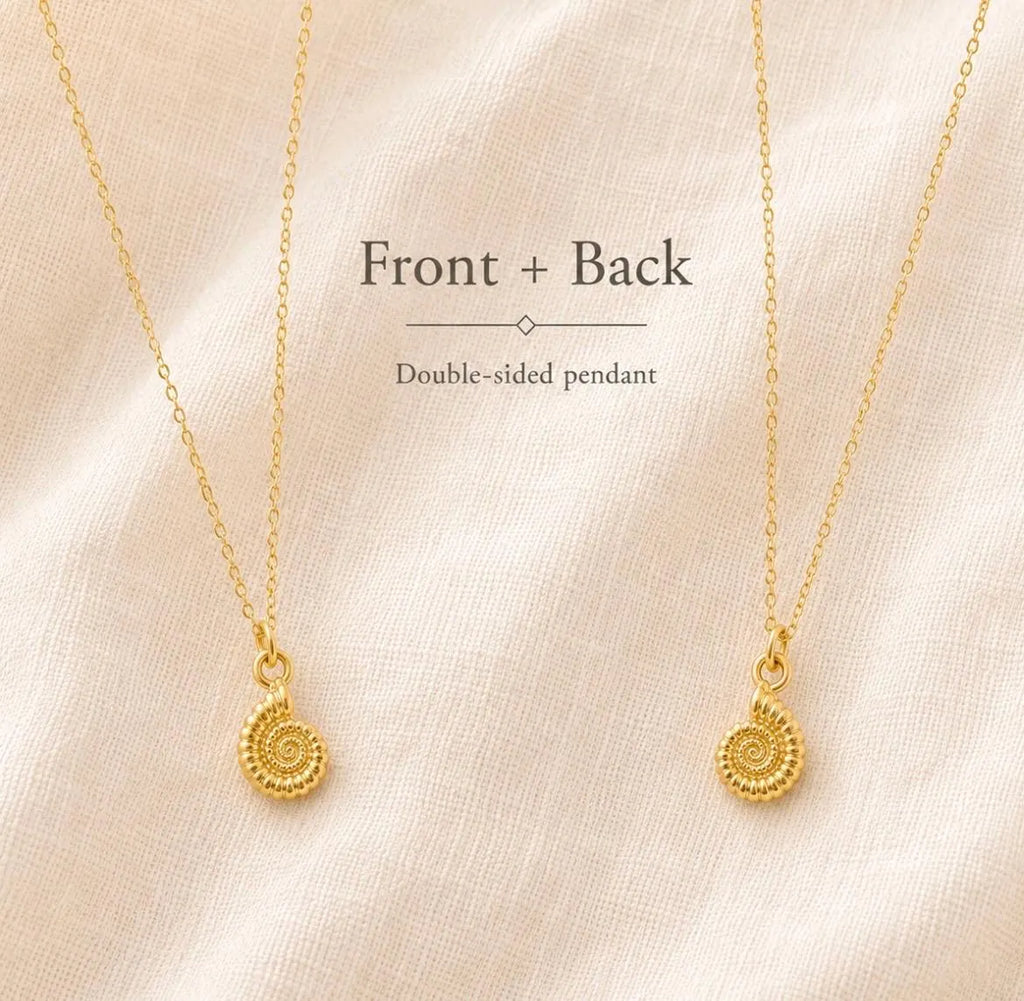 Two gold chain necklaces with matching spiral pendant charms are displayed on a soft beige fabric background, with text reading 'Front + Back' and 'Double-sided pendant'.