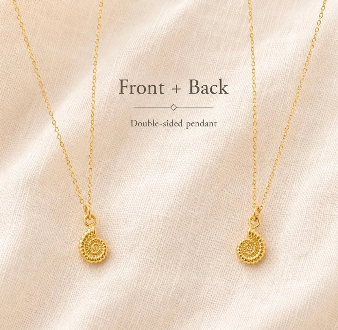 Two gold chain necklaces with matching spiral pendant charms are displayed on a soft beige fabric background, with text reading 'Front + Back' and 'Double-sided pendant'.